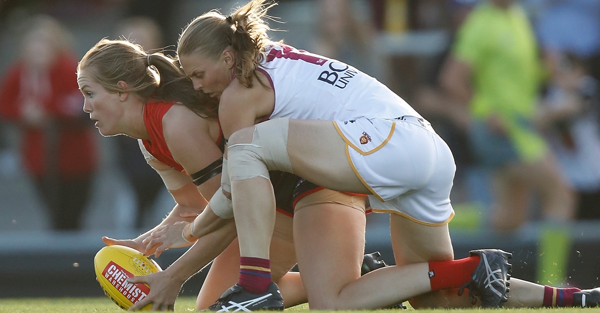 WebLutkinsTOTW.jpg Eden Zanker of the Demons is tackled by Kate Lutkins during Round 5. - Kate Lutkins,Sabrina Frederick-Traub